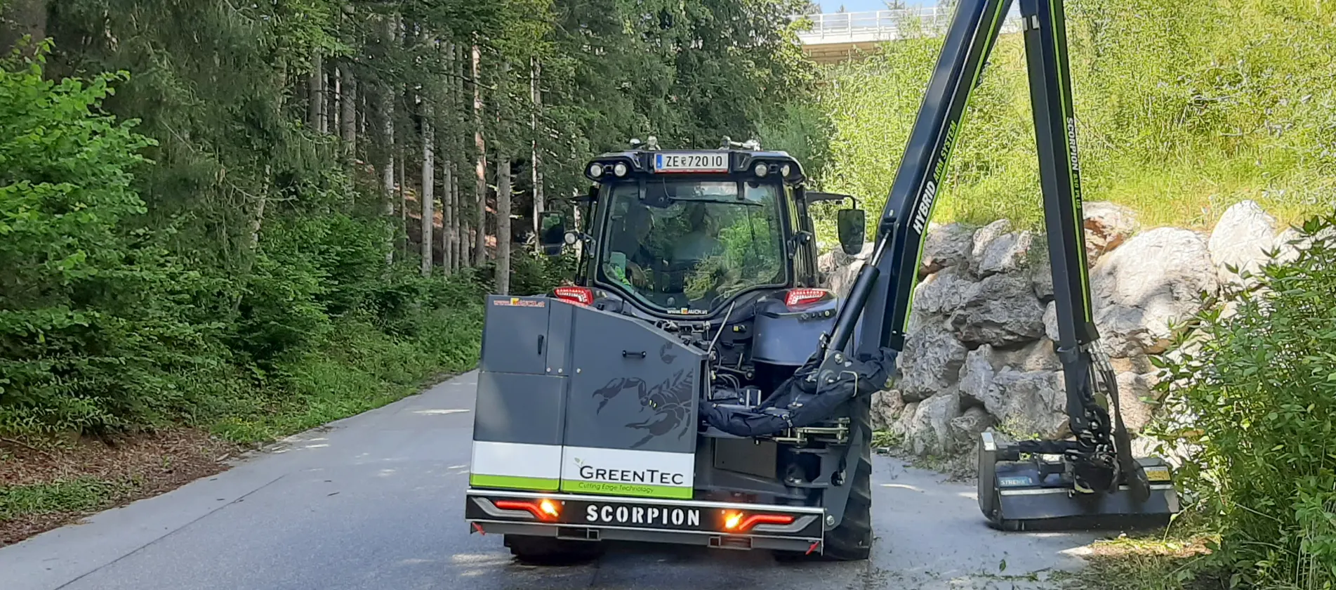 Roadside maintenance with large boom mower