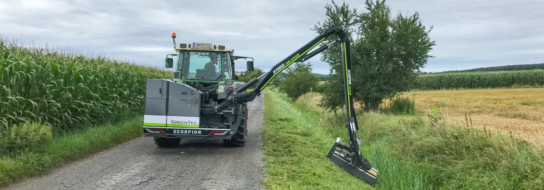 Long reach mower mounted on tractor