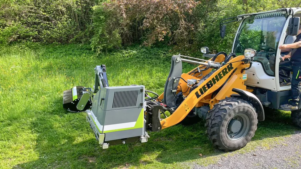 Boom mower mounted on Liebherr 506 Compact Loader