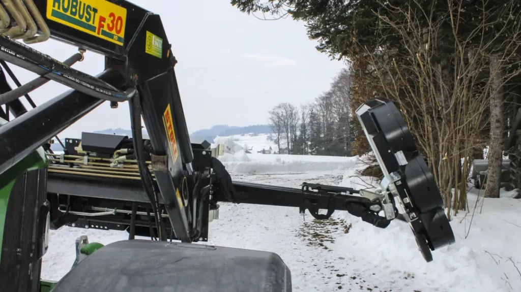 GreenTec Multi Carrier HXF 2802 mounted on a Stoll Robust F30 HD front loader